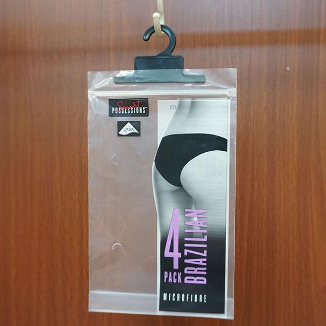 bolsos de empaquetado transparentes materiales del HDPE biodegradable barato k del precio de la fábrica de China para la ropa con la suspensión