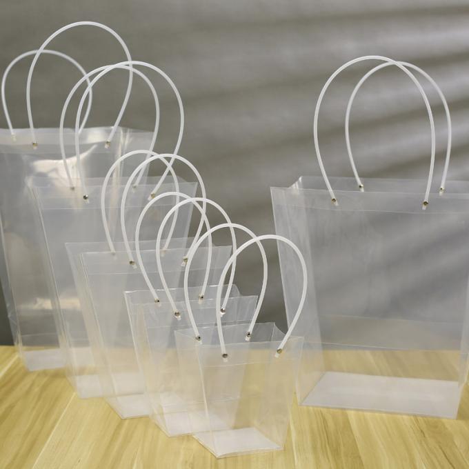 La floristería PP transparentes empaqueta el empaquetado en conserva del regalo de la fruta de la parte inferior que cuece de la bolsa de asas de gran tamaño ancha cuadrada de la torta